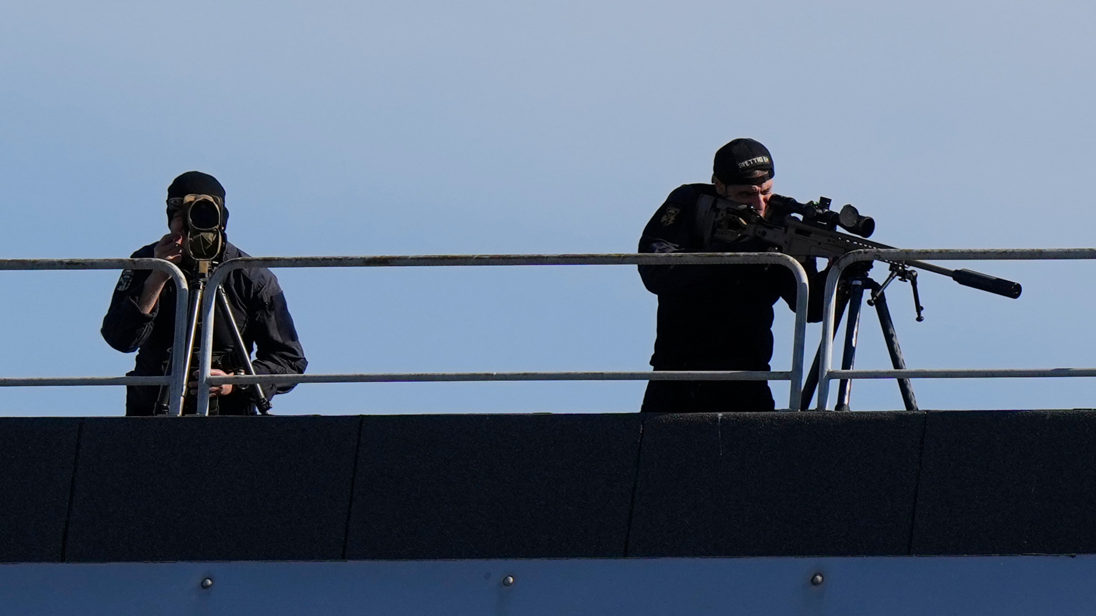 Snipers patrol on the roof of the Fruili Hotel where the Israeli national team is staying, ahead of a World Cup 2026, Group I qualifying soccer match between Italy and Israel at the Friuli Stadium in Udine, Italy, Tuesday, Oct.14, 2025. (AP Photo/Luca Bruno)