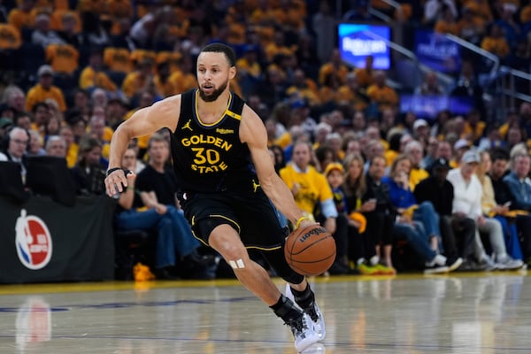 Golden State Warriors guard Stephen Curry moves the ball during the first half of Game 6 of an NBA basketball first-round playoff series against the Houston Rockets, Friday, May 2, 2025, in San Francisco. (AP Photo/Godofredo A. Vásquez)