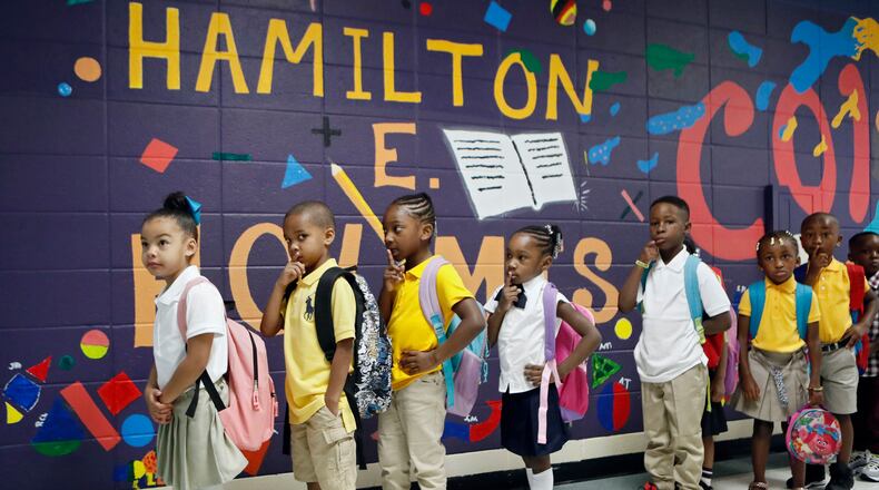 8/6/18 - East Point -  Students wait in line to be taken to their classrooms.  It was the first day of school at Hamilton E. Holmes Elementary in East Point.  Members of the 100 Black Men of Atlanta were on hand to greet students.    BOB ANDRES  /BANDRES@AJC.COM