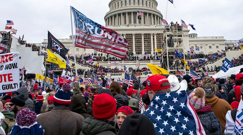 FILE - Rioters loyal to President Donald Trump rally at the U.S. Capitol in Washington on Jan. 6, 2021. A new poll shows that a year after the deadly Jan. 6 insurrection at the U.S. Capitol, only about 4 in 10 Republicans recall the attack by supporters of former President Donald Trump as very violent or extremely violent. A new poll shows that a year after the deadly Jan. 6 insurrection at the U.S. Capitol, only about 4 in 10 Republicans recall the attack by supporters of former President Donald Trump as very violent or extremely violent. (AP Photo/Jose Luis Magana, File)