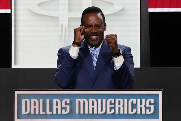 Dallas Mavericks' Rolando Blackman celebrates after NBA Deputy Commissioner Mark Tatum announced that the Mavericks won the first pick in the 2025 NBA draft during the draft lottery in Chicago, Monday, May 12, 2025. (AP Photo/Nam Y. Huh)
