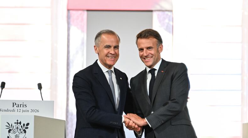French President Emmanuel Macron, right, and Canada's Prime Minister Mark Carney at the Palais de l'Elysee in Paris, Friday June 12, 2026. (AP Photo/Emma Da Silva, Pool)