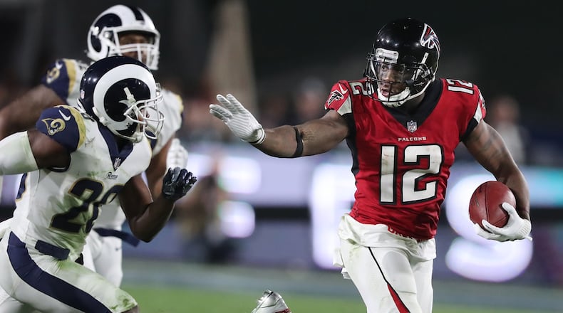 Falcons wide receiver Mohamed Sanu makes a long first down reception on a touchdown drive against the Rams during the fourth quarter in their NFL Wild Card Game on Saturday, January 6, 2018, in Los Angeles.    Curtis Compton/ccompton@ajc.com