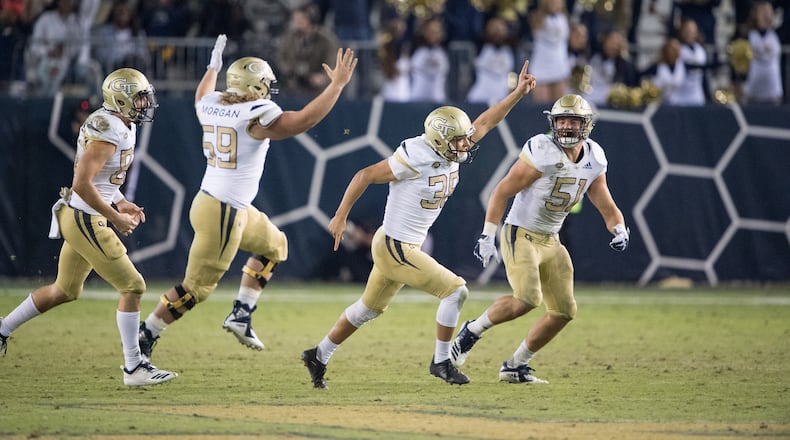 ATLANTA, GA - NOVEMBER 17: Place kicker Wesley Wells #38 of the Georgia Tech Yellow Jackets celebrates with teammates after kicking a field goal during the fourth quarter in their game against the Virginia Cavaliers at Bobby Dodd Stadium on November 17, 2018 in Atlanta, Georgia. (Photo by Michael Chang/Getty Images)