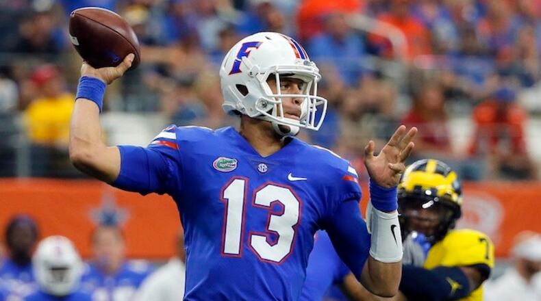 Florida quarterback Feleipe Franks (13) throws a pass during an NCAA college football game against Michigan on Saturday, Sept. 2, 2017, in Arlington, Texas. (AP Photo/Tony Gutierrez)