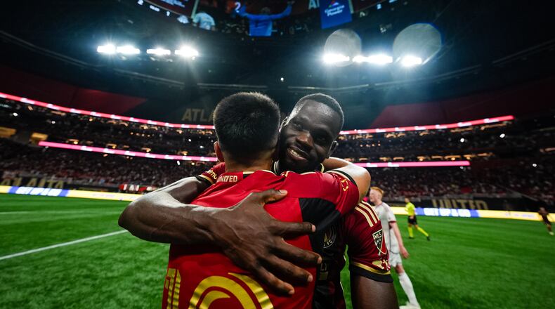 Atlanta United forward Jamal Thiaré #29 and Atlanta United midfielder Thiago Almada #10 celebrate a goal during the match against the Toronto FC at Mercedes-Benz Stadium in Atlanta, GA on Saturday June 29, 2024. (Photo by Mitch Martin/Atlanta United)