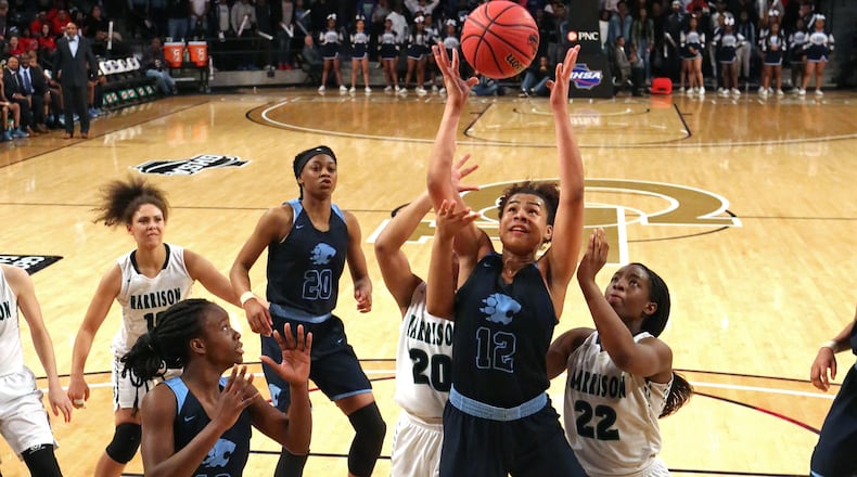 Lovejoy forward J'Aunna Robinson (12) grabs a rebound during the second half against Harrison of the GHSA Class AAAAAA Girls State Championship at McCamish Pavilion Friday, March 9, 2018, in Atlanta. Lovejoy won 57-41.