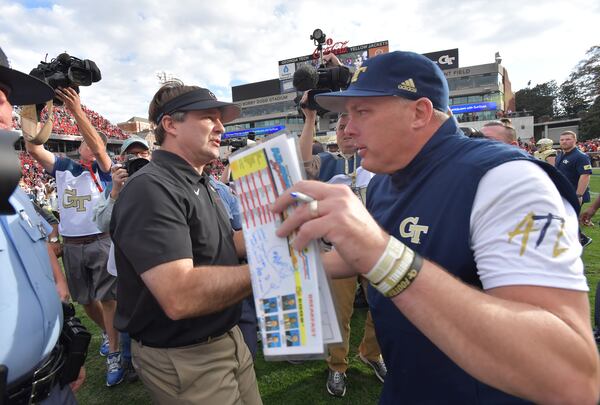 Georgia head coach Kirby Smart and Georgia Tech head coach Geoff Collins shake hands during an NCAA college football game at Bobby Dodd Stadium on Saturday, November 30, 2019. Georgia won 52-7 over the Georgia Tech. (Hyosub Shin / Hyosub.Shin@ajc.com)
