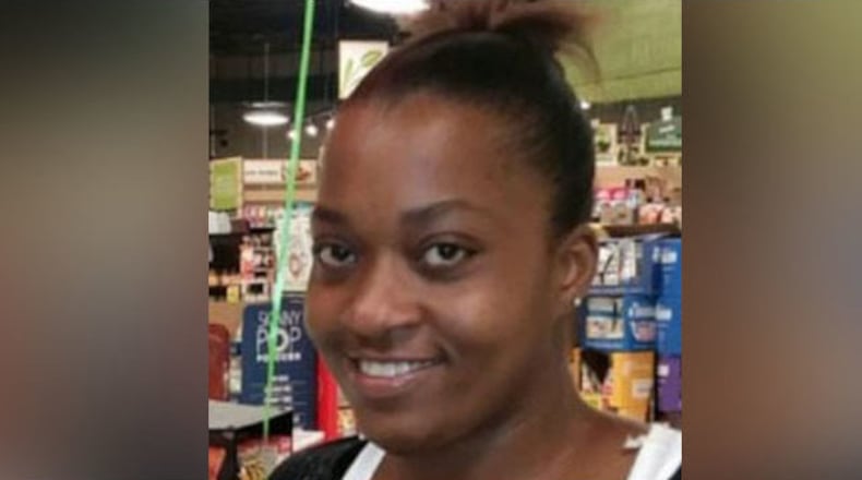 Police say Felicia Miller was killed in a driveway in front of her children.