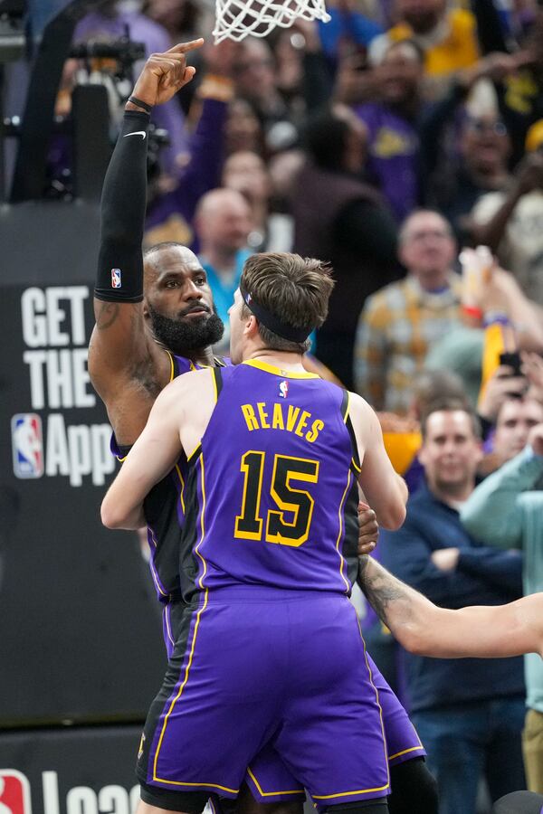 Los Angeles Lakers forward LeBron James (23) reacts after hitting the game winning shot against the Indiana Pacers at the end of an NBA basketball game in Indianapolis, Wednesday, March 26, 2025. (AP Photo/AJ Mast)