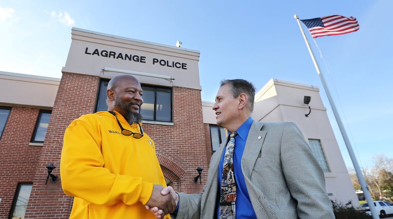 LaGrange Police Chief Louis M. Dekmar, right, and Troup County NAACP president Ernest Ward shake hands as they meet on Wednesday, Jan. 25, 2017, at the police department in LaGrange. The LaGrange police chief on Thursday will publicly apologize and acknowledge his agency’s role in the 1940 lynching of a black man taken from the local jail. CURTIS COMPTON/CCOMPTON@AJC.COM