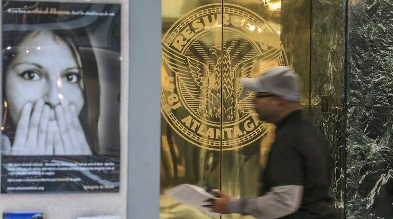 Employees at Atlanta City Hall were handed instructions as they passed through the front doors March 23, the day after the city fell prey to a ransomware attack, to not turn on computers or log on to their workstations. Hackers were seeking $50,000 in the attack. JOHN SPINK/JSPINK@AJC.COM