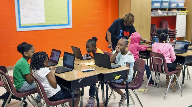 Atlanta Public Schools students like these third graders will have access to the Fulton County Library System beginning in the fall. Bob Andres / bandres@ajc.com AJC FILE PHOTO