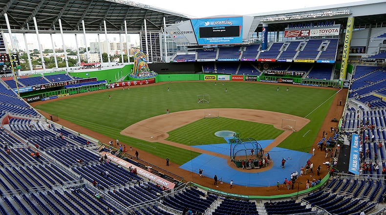 In this May 14, 2013, file photo, the Cincinnati Reds take batting practice at Marlins Park before a baseball game against the Miami Marlins in Miami. A person familiar with the decision says the Marlins have been awarded the 2017 All-Star Game, and an announcement by baseball Commissioner Rob Manfred is planned for this week at the team’s ballpark. (AP Photo/Lynne Sladky, File)