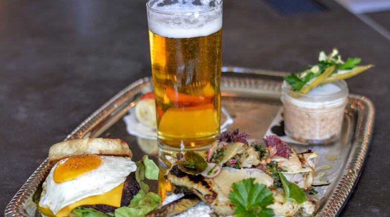 The chef’s breakfast at One-Eared Stag is an ever-changing brunch menu item — but it always comes with a beer. (Henri Hollis)