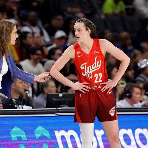 Indiana Fever head coach Stephanie White talks with Indiana Fever guard Caitlin Clark (22) during the first half of an WNBA basketball game against the Las Vegas Aces Sunday, July 12, 2026, in Las Vegas. (Steve Marcus/Las Vegas Sun via AP)