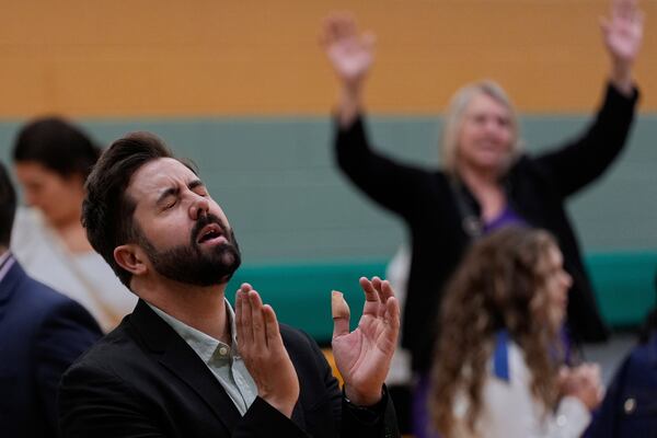 River Church Cincinnati pastor Cory Bowman, who is Vice President JD Vance's half brother and Cincinnati mayoral candidate, prays during Easter worship service in the Hays Porter Elementary School gym Sunday, April 20, 2025, in Cincinnati. (AP Photo/Carolyn Kaster)