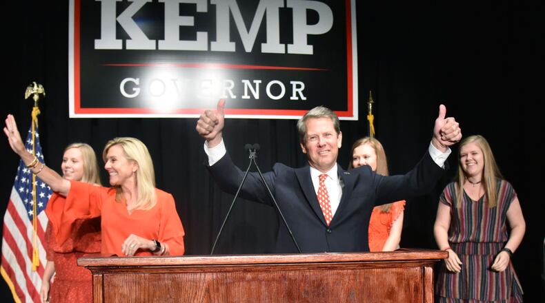 GOP gubernatorial candidate Brian Kemp gives thumbs up as he takes on stage with his family during his election watch party at The Classic Center in Athens on Tuesday, November 6, 2018. HYOSUB SHIN / HSHIN@AJC.COM