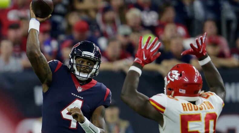 Texans quarterback Deshaun Watson throws a pass under pressure by Justin Houston of the Chiefs in the fourth quarter at NRG Stadium last Sunday night in Houston.