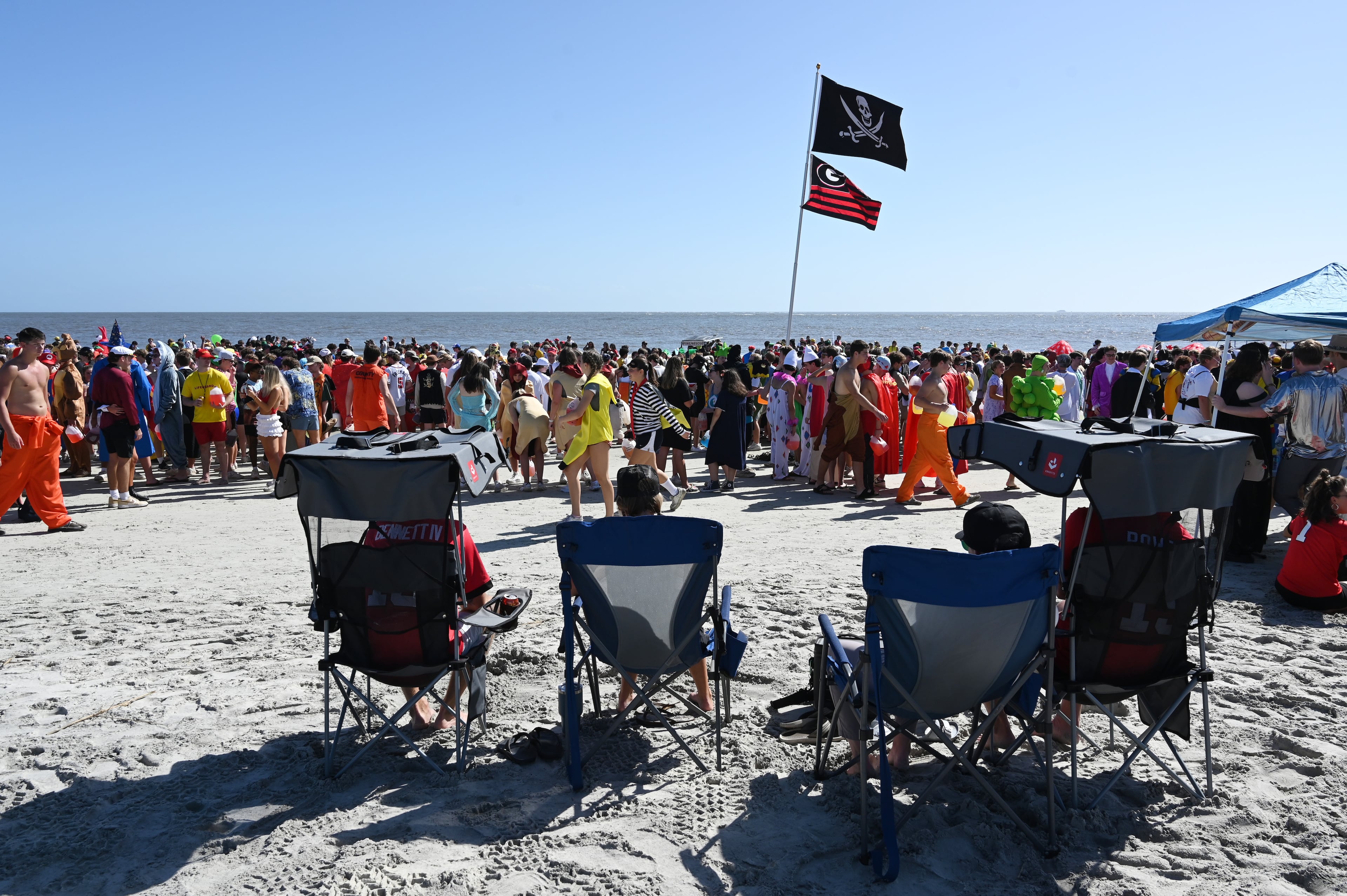 Thousands of UGA students gather during the annual “Frat Beach” party for the weekend of the Georgia-Florida football game on St. Simons Island, Friday, November 1, 2024. On the weekend of the Georgia-Florida football game, St. Simons Island’s East Beach becomes “Frat Beach,” an open-air party teeming with thousands of college students. (Hyosub Shin / AJC)