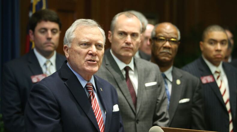 Gov. Nathan Deal, forefront, and Lt. Gov. Casey Cagle, right, have received major financial support from the nursing home industry, which stands to benefit from a proposed reimbursement hike for nursing home operators. The Department of Community Health will consider the $26 million reimbursement increase at its meeting Nov. 11. JASON GETZ / JGETZ@AJC.COM