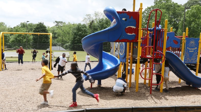 Children play on a school playground in Atlanta. Rep. Demetrius Douglas, D-Stockbridge, has been calling for a recess mandate for five years. Gov. Brian Kemps signature on House Bill 1283 is a legislative victory for him and other supports of the measure. (File))