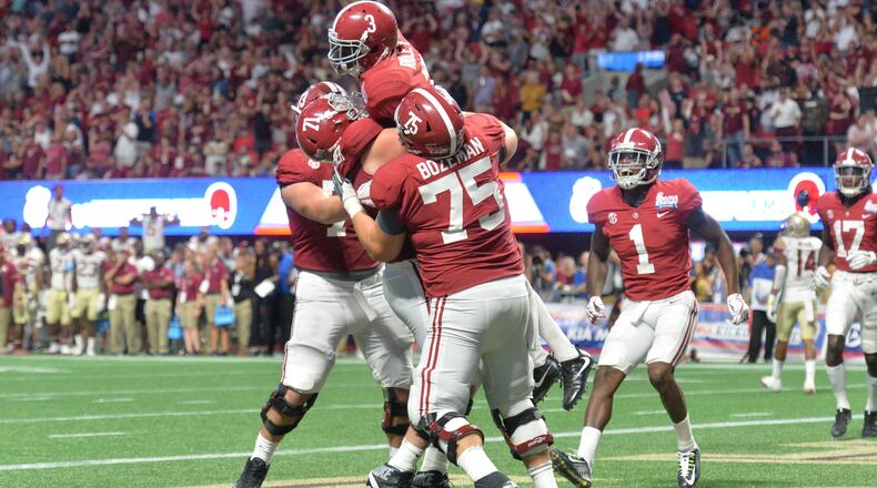 Alabama wide receiver Calvin Ridley (3) celebrates after he made 3-points catch in the second half of the 2017 Chick-Fil-A Kickoff game at the Mercedes-Benz Stadium on Saturday, September 2, 2017. HYOSUB SHIN / HSHIN@AJC.COM