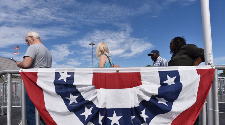 Voters lined up for Thursday for early voting outside in Lawrenceville. HYOSUB SHIN