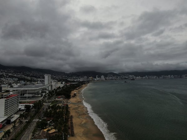 Acapulco Bay is void of boats while they are stored on shore as Hurricane Erick brings dark clouds, Thursday, June 19, 2025. (AP Photo/Fernando Llano)default