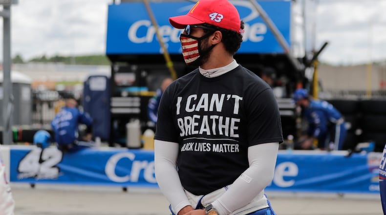 Driver Bubba Wallace wears a "I Can't Breath, Black Lives Matter" shirt before NASCAR race Sunday, June 7, 2020,at Atlanta Motor Speedway in Hampton, Ga. Wallace, the only full-time black driver in any of NASCAR’s top three series, encouraged his peers to speak up about racial injustice.