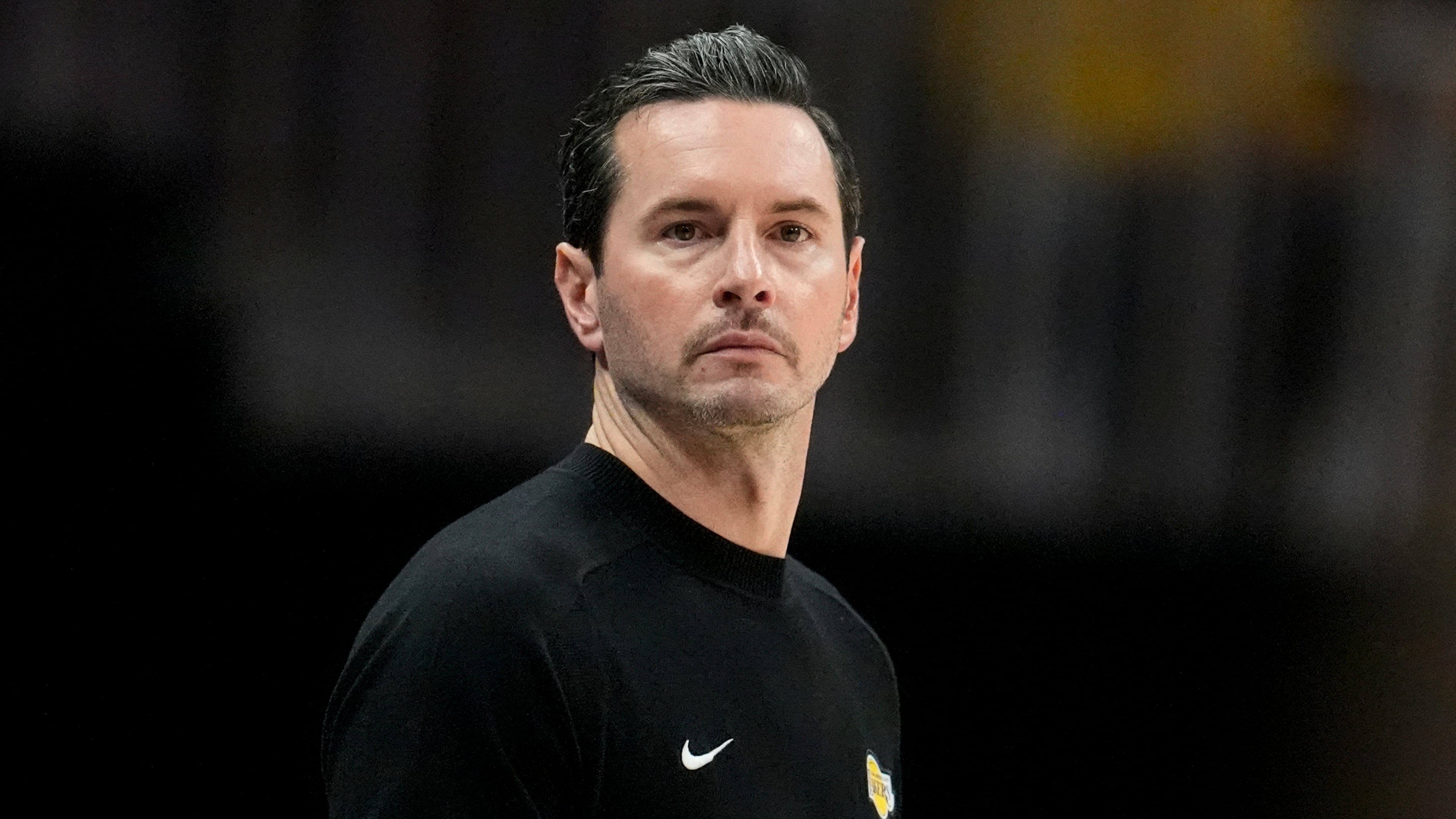 Los Angeles Lakers head coach JJ Redick watches play against the Atlanta Hawks during the second half of an NBA basketball game, Saturday, Nov. 8, 2025, in Atlanta. (AP Photo/Mike Stewart)
