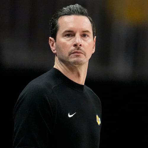 Los Angeles Lakers head coach JJ Redick watches play against the Atlanta Hawks during the second half of an NBA basketball game, Saturday, Nov. 8, 2025, in Atlanta. (AP Photo/Mike Stewart)