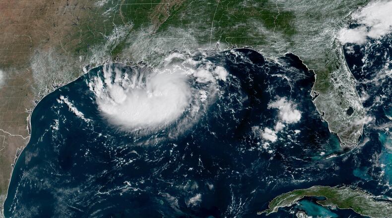 This satellite image released by NOAA shows Potential Tropical Cyclone Five forming over the Gulf of Mexico on Monday, Aug. 31, 2026. (NOAA via AP)