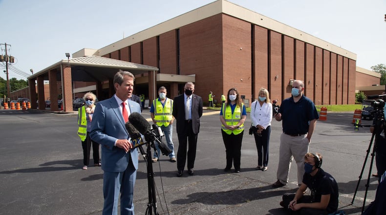 Speaking with the press Friday after touring a COVID-19 testing site at the Lilburn First Baptist Church in Gwinnett County, Gov. Brian Kemp said he did not see enough public buy-in to institute a statewide requirement to wear masks to fight the spread of the disease. (PHOTO by Steve Schaefer for the AJC)