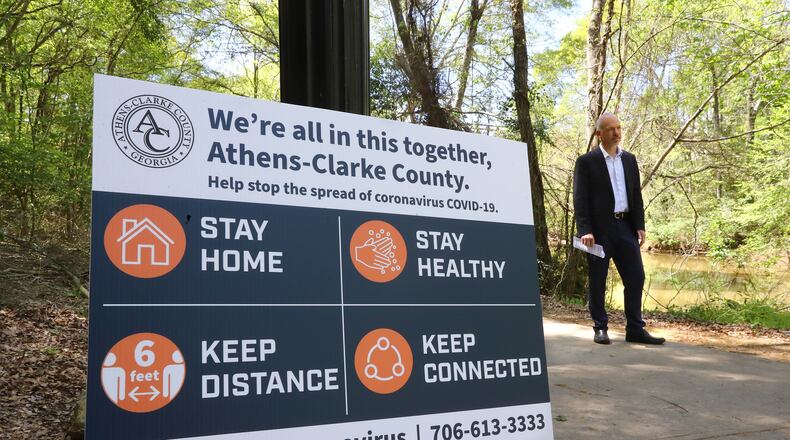 April 2, 2020 Athens: Mayor Kelly Girtz films one of his public service video addresses by the North Oconee River in Dudley Park to encourage and inform local residents on Thursday, April 2, 2020, in Athens, where a mandatory shelter in place has been in effect long before many metro Atlanta towns took similar steps.   Curtis Compton ccompton@ajc.com