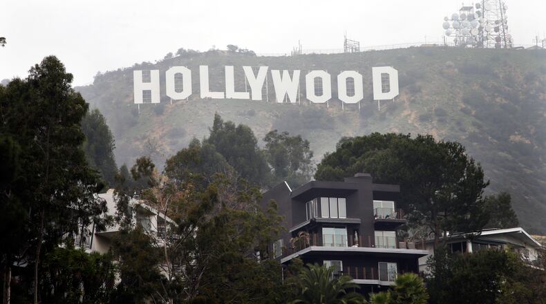 Homes sit on the hillside near the Hollywood Sign. Arriving at the landmark sign that towers magnificently over Los Angeles' skyline requires traipsing through a densely populated hillside neighborhood of 20,000 people and numerous multimillion-dollar homes located on steep, narrow, almost impassable streets. AP/Jae C. Hong