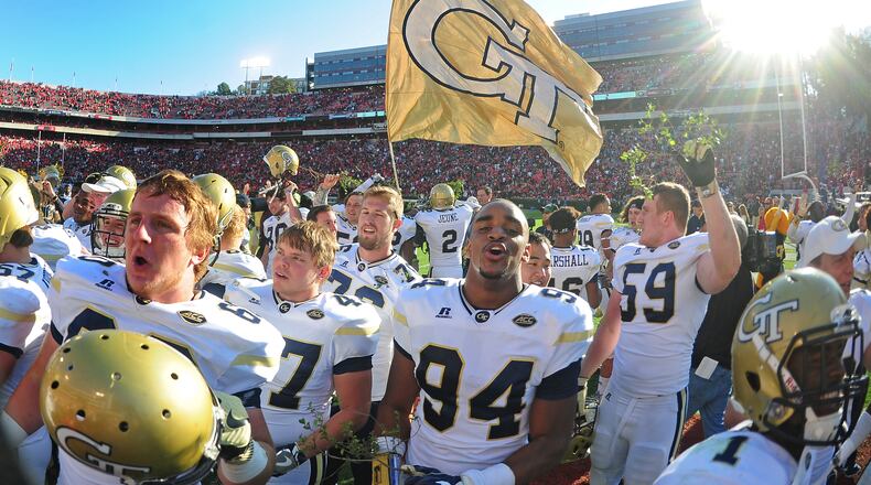 Members of the Georgia Tech Yellow Jackets celebrate after the game against the Georgia Bulldogs at Sanford Stadium on November 26, 2016 in Athens, Georgia. (Photo by Scott Cunningham/Getty Images)