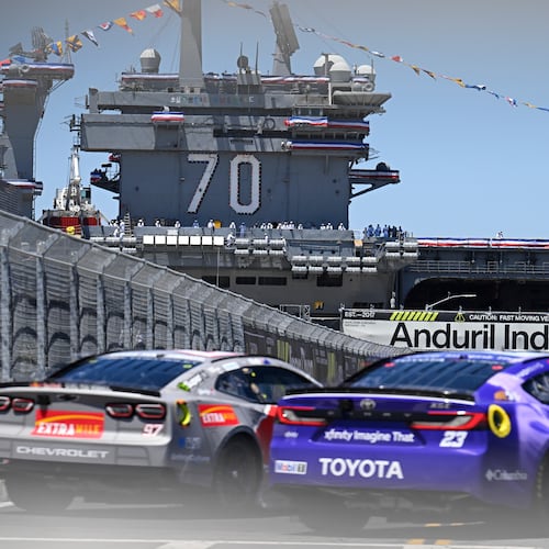 Shane Van Gisbergen (97) and Bubba Wallace (23) come out of Turn 2 during a NASCAR Cup Series auto race, Sunday, June 21, 2026, in Coronado, Calif. (AP Photo/Denis Poroy)