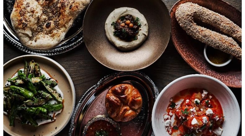 A look at some featured menu items including Zaatar Laffa, Hummus No. 1, Jerusalem bagel, Okra, Kubaneh, and Watermelon at Aziza.