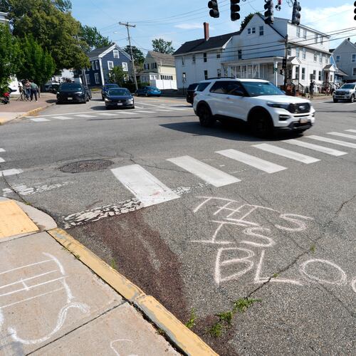 Blood is seen on the pavement near the scene of a shooting involving U.S. Immigration and Customs Enforcement, Monday, July 13, 2026 in Biddeford, Maine. (AP Photo/Robert F. Bukaty)