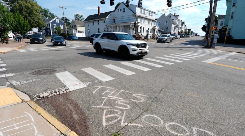 Blood is seen on the pavement near the scene of a shooting involving U.S. Immigration and Customs Enforcement, Monday, July 13, 2026 in Biddeford, Maine. (AP Photo/Robert F. Bukaty)