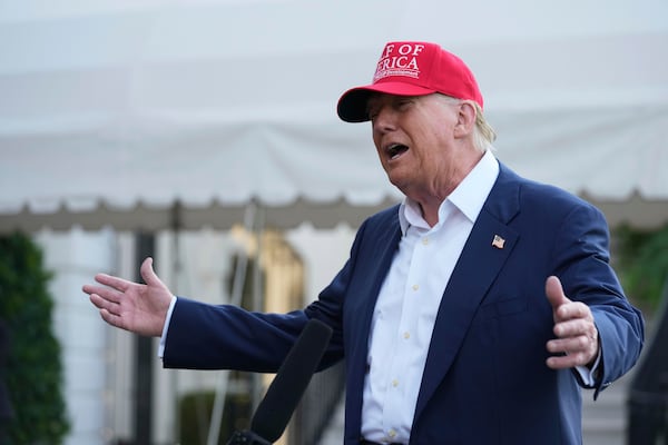 President Donald Trump speaks to the media before walking across the South Lawn of the White House to board Marine One en route to Joint Base Andrews, Md., and on to Florida, Tuesday, July 1, 2025, in Washington. (AP Photo/Mark Schiefelbein)