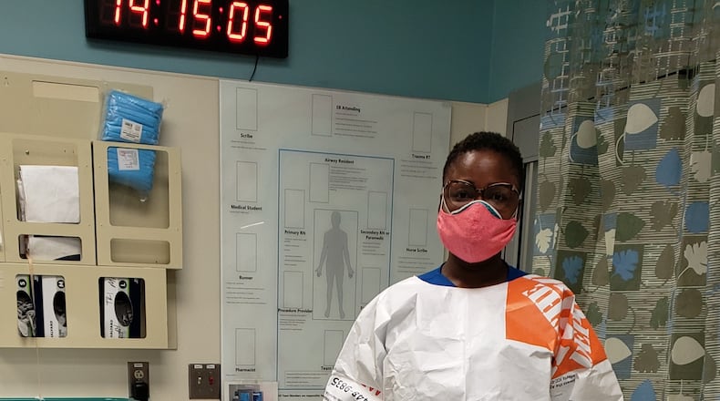 A lead nurse at Grady Memorial Hospital wears a protective isolation gown made of Tyvek provided by the Associated Builders and Contractors of Georgia.