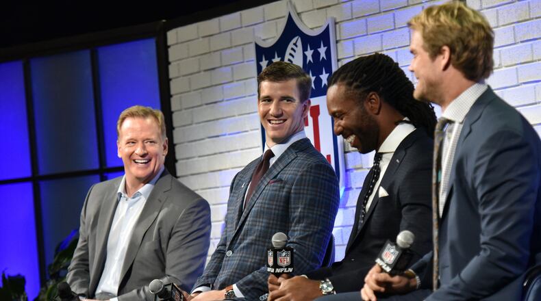 NFL Commissioner Roger Goodell, left, and players Eli Manning, Greg Olsen and Larry Fitzgerald, discussed topics including patriotism with fans. AJC photo: Hyosub Shin