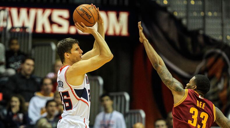 Atlanta Hawks shooting guard Kyle Korver (26) attempts a three over Cleveland Cavaliers small forward Alonzo Gee (33) in the first quarter at Philips Arena.
