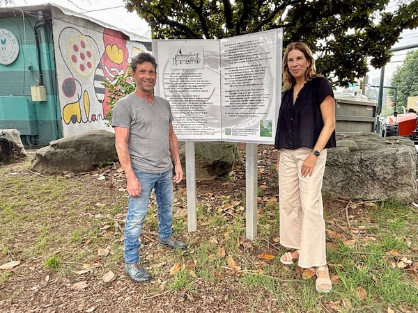 Poet Robert F. Barsky (left) and abstract artist Susan Ker-Seymer (right) stand by one of the four current installations of "The Beltline Chronicles" alongside the Atlanta's Beltline on June 4, 2025. (Danielle Charbonneau)