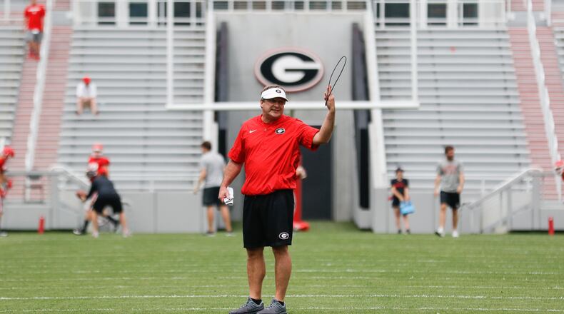 Georgia head coach Kirby Smart directs players during spring practice Saturday, April 13, 2019, in Athens.
