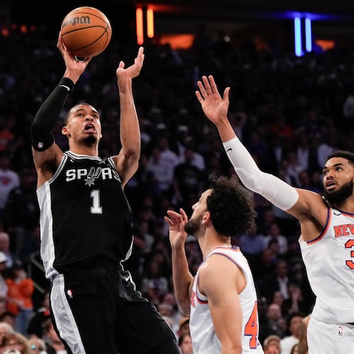 San Antonio Spurs forward Victor Wembanyama (1) shoots over New York Knicks center Karl-Anthony Towns (32) during second half of Game 3 of the NBA Finals basketball series, Monday, June 8, 2026, in New York. (AP Photo/Ross D. Franklin)