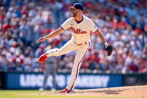 Philadelphia Phillies starting pitcher Zack Wheeler delivers during the ninth inning of a baseball game against the Cincinnati Reds, Sunday, July 6, 2025, in Philadelphia. (AP Photo/Chris Szagola)