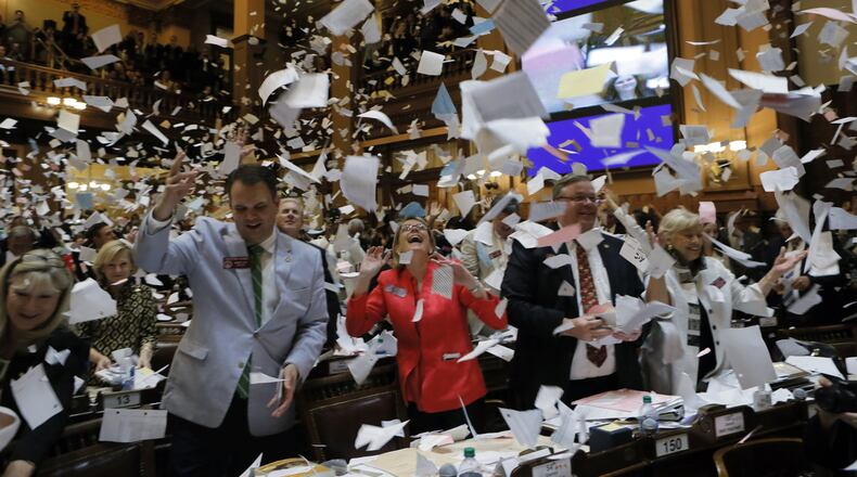 Georgia House members mark the end of the General Assembly’s 2017 legislative session well past midnight Thursday. BOB ANDRES /BANDRES@AJC.COM